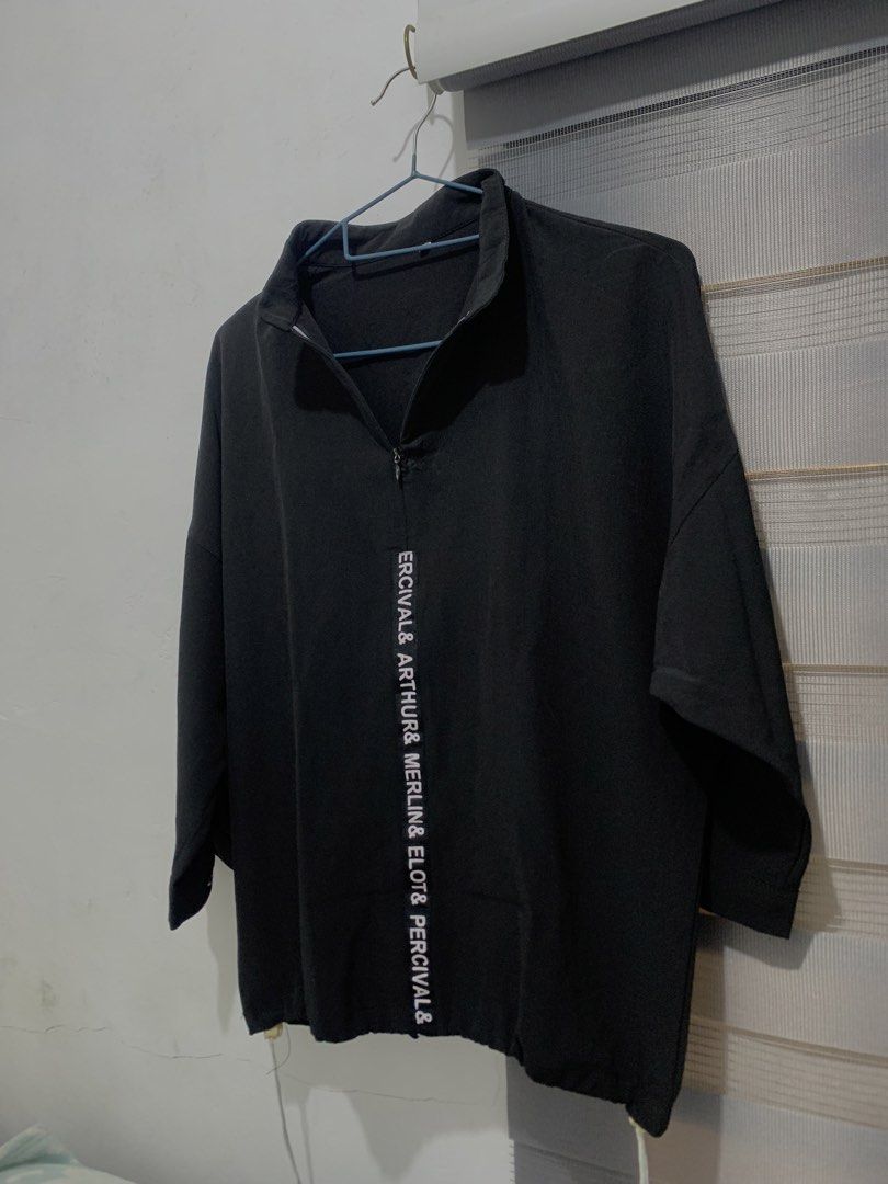 Black Half-Zip Pullover (Category: Blouses) located in Caloocan City. Submitted by jjasss.mn_ (Listing ID 1459531775, Image 1). Description: Features vertical white lettering running down the front placket. Soft and cold fabric Can fit up to Medium .