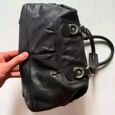 Black Leather Coach Handbag (Category: Luxury Bags & Wallets) located in Manila. Submitted by _mrkeith (Listing ID 1459597269, Image 3). Description: - Genuine black leather Coach handbag - Classic Coach logo detail on the front - Comfortable double handles - Elegant silver hardware - Soft, gathered leather texture - Secure zipper closure - Spacious interior for your daily essentials - Stylish and versatile for everyday use.