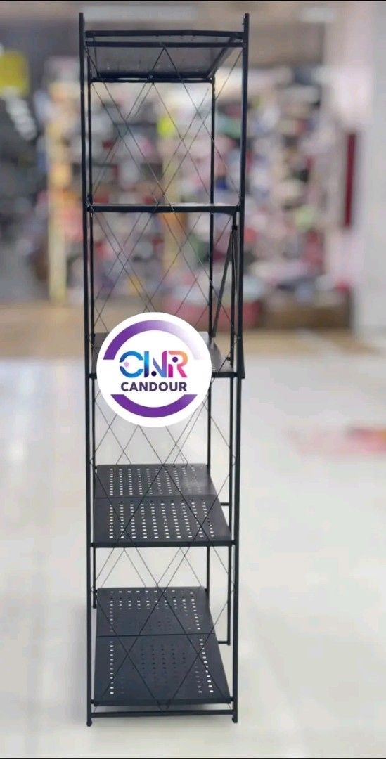 Black Metal Folding Shelf Rack 4 Tier (Category: Shelves, Cabinets & Racks) located in Quezon City. Submitted by marecel146 (Listing ID 1459687660, Image 2). Description: - Sturdy black metal construction - Four tiers with perforated shelves - Folds flat for convenient storage - Ideal for organizing books, plants, and decor - Ready for its new home!.