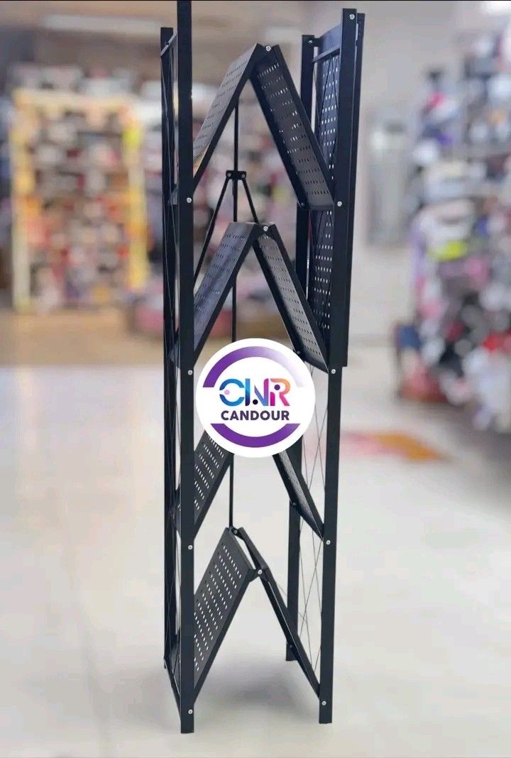 Black Metal Folding Shelf Rack 4 Tier (Category: Shelves, Cabinets & Racks) located in Quezon City. Submitted by marecel146 (Listing ID 1459687660, Image 1). Description: - Sturdy black metal construction - Four tiers with perforated shelves - Folds flat for convenient storage - Ideal for organizing books, plants, and decor - Ready for its new home!.