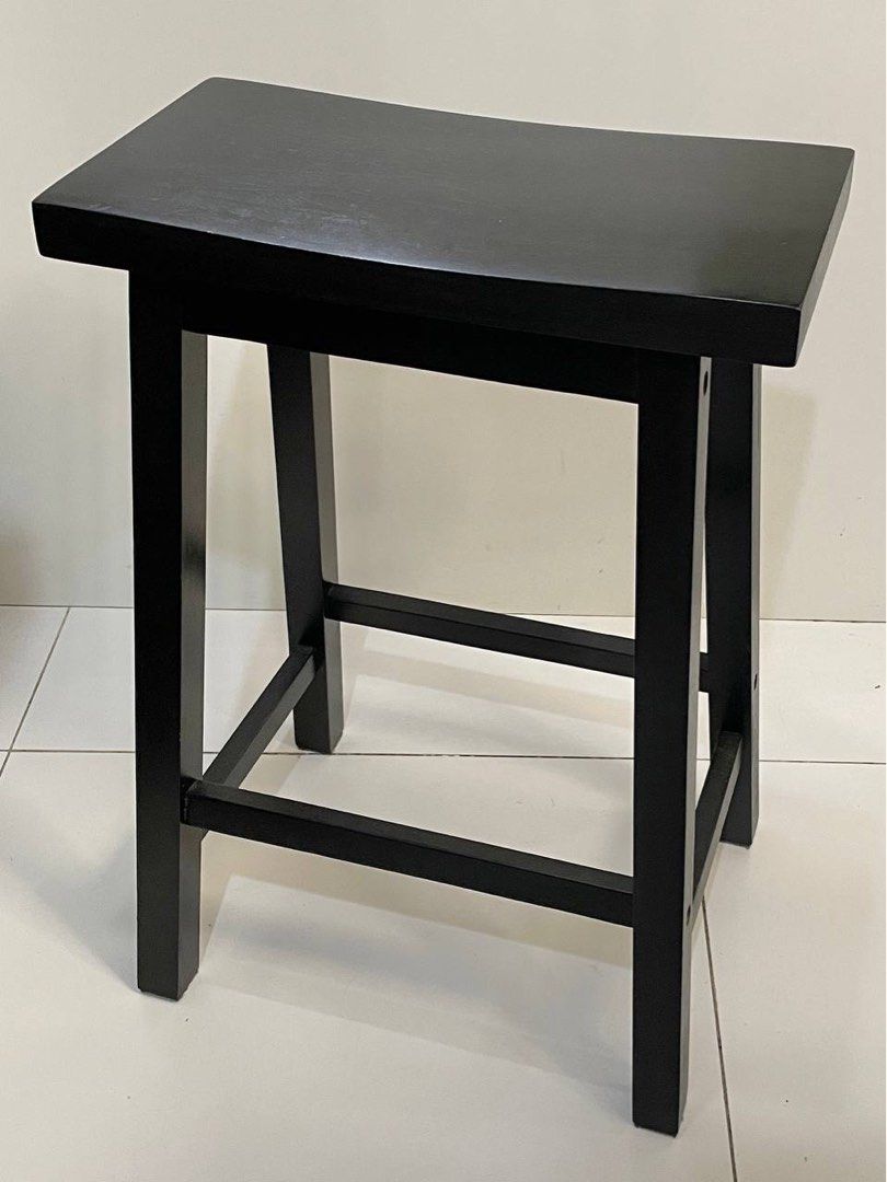 Black Wooden Saddle Stool (Category: Chairs) located in Makati City. Submitted by eleven678 (Listing ID 1459615365, Image 1). Description: - Simple black wooden stool - Comfortable saddle seat design - Four sturdy legs with crossbars for stability - Ideal for kitchen counters or bar areas - Compact size fits most spaces - Easy to clean surface Wooden Saddle Stool - 43cm L x 23/32cm W x 61cm H - 4.75 kilos Og price: 1200.
