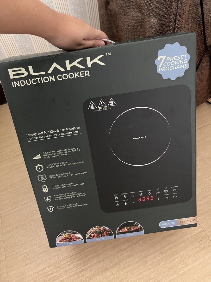 BLAKK Induction Cooker with 7 Preset Cooking Programs (Category: Cookers) located in Manila. Submitted by buenaventu09221 (Listing ID 1459551685, Image 1). Description: - BLAKK Induction Cooker - Suitable for 12-26cm pans/pots - 7 preset cooking programs - 5-level temperature settings - Sleek glass touch panel - Safety features: Child lock & overheat protection - Auto shut-off function - Ideal for daily cooking needs.