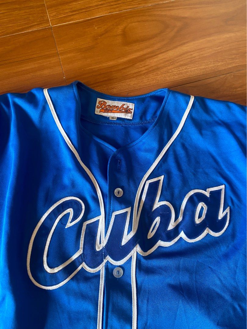 Blue Cuba Baseball Jersey XL (Category: Tshirts & Polo Shirts ) located in Tayabas. Submitted by marco.av (Listing ID 1459495921, Image 3). Description: - Blue baseball jersey with 'Cuba' embroidered on the front. - White piping details along the placket and sleeves. - Short sleeves, button-up front. - Tag size: XL. - Measurements: Length 33 inches, Width 32 inches, Sleeves 9 inches..
