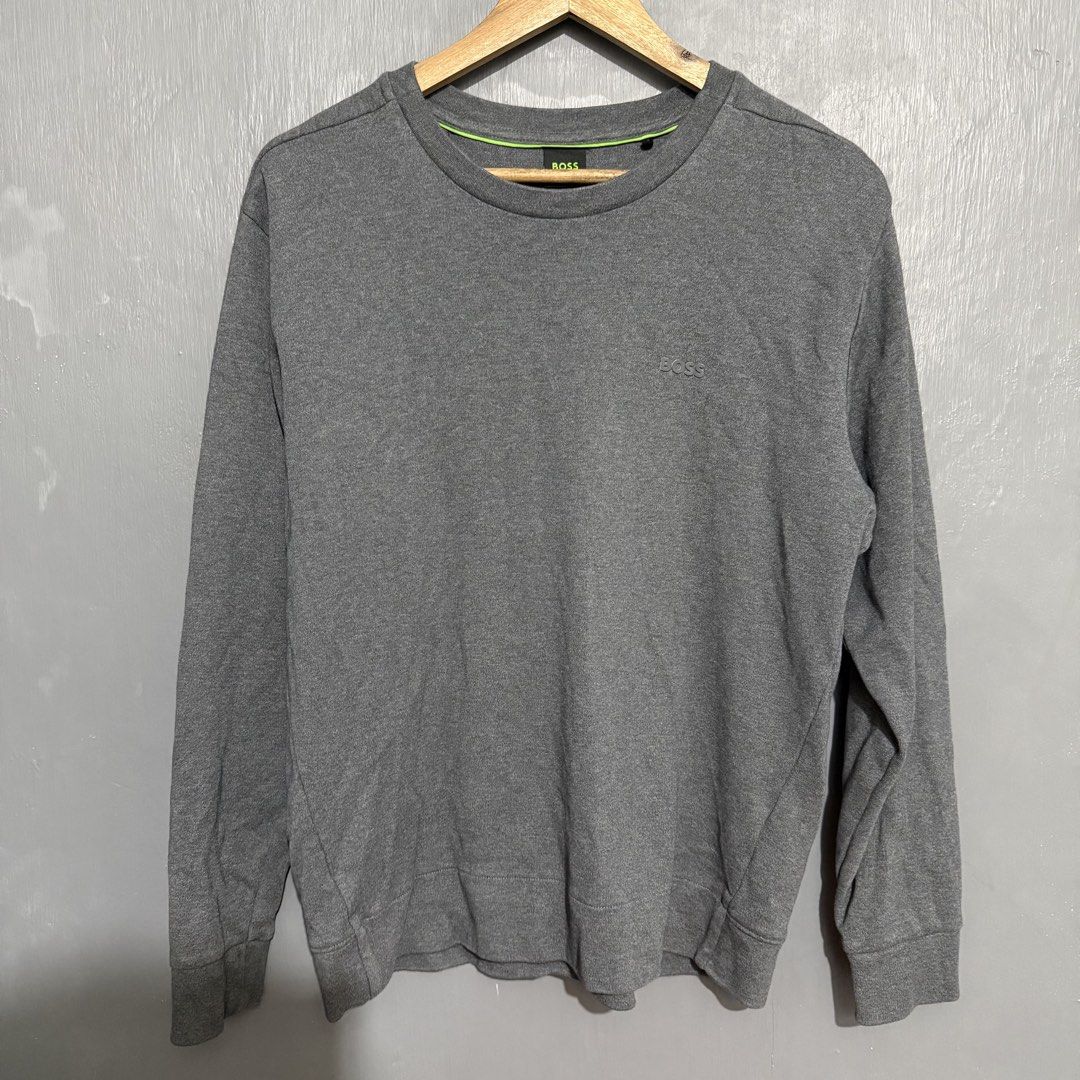 BOSS Grey Crewneck Sweatshirt Size L (Category: Coats, Jackets and Outerwear) located in Manila. Submitted by preciousma24494 (Listing ID 1459588812, Image 2). Description: - Grey BOSS sweatshirt Size: Large 21/26 - Crewneck style with long sleeves - Subtle BOSS logo embroidered on the chest - Comfortable and classic design - Ideal for layering or wearing solo - Perfect for everyday casual outfits.