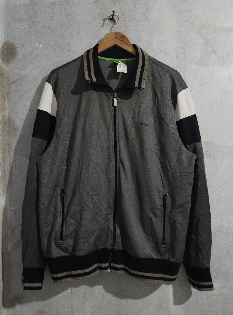 BOSS Track Jacket Grey Black White Colorblock (Category: Coats, Jackets and Outerwear) located in Tabaco. Submitted by strain_finds (Listing ID 1459621880, Image 1). Description: - BOSS track jacket - Color: Grey with black and white colorblock sleeves - Features: Full zip front, zippered pockets - Details: Ribbed collar, cuffs, and hem - Ideal for: Casual wear or light workouts.