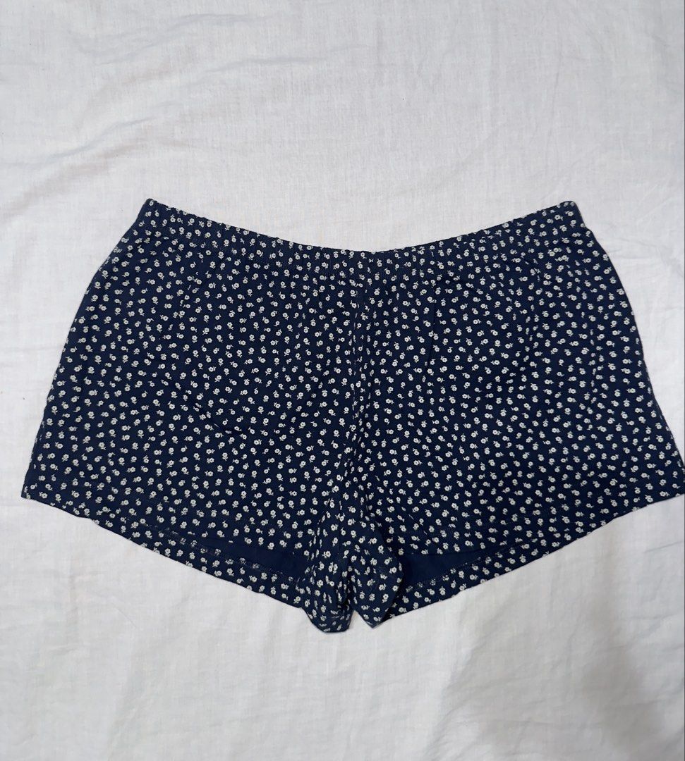 Brandy Melville Navy Floral Shorts (Category: Shorts) located in Santa Ana. Submitted by fatikilla (Listing ID 1459620941, Image 1). Description: - Navy blue shorts - All-over white floral print - Comfortable elastic waistband - Super cute and comfy - Ideal for lounging or casual wear - Great for summer.