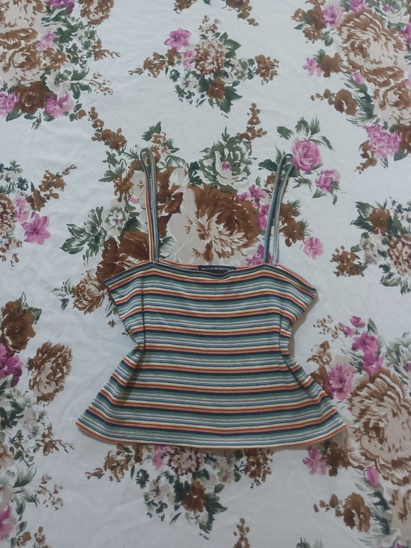 Brandy Melville Striped Top (Category: Sleeveless) located in San Pablo. Submitted by halloweenxx (Listing ID 1459668243, Image 3). Description: - Cute Brandy Melville cropped tank top - Features a colorful stripe pattern - Thin spaghetti straps - Best fits size small or one size - Perfect for casual wear or layering.