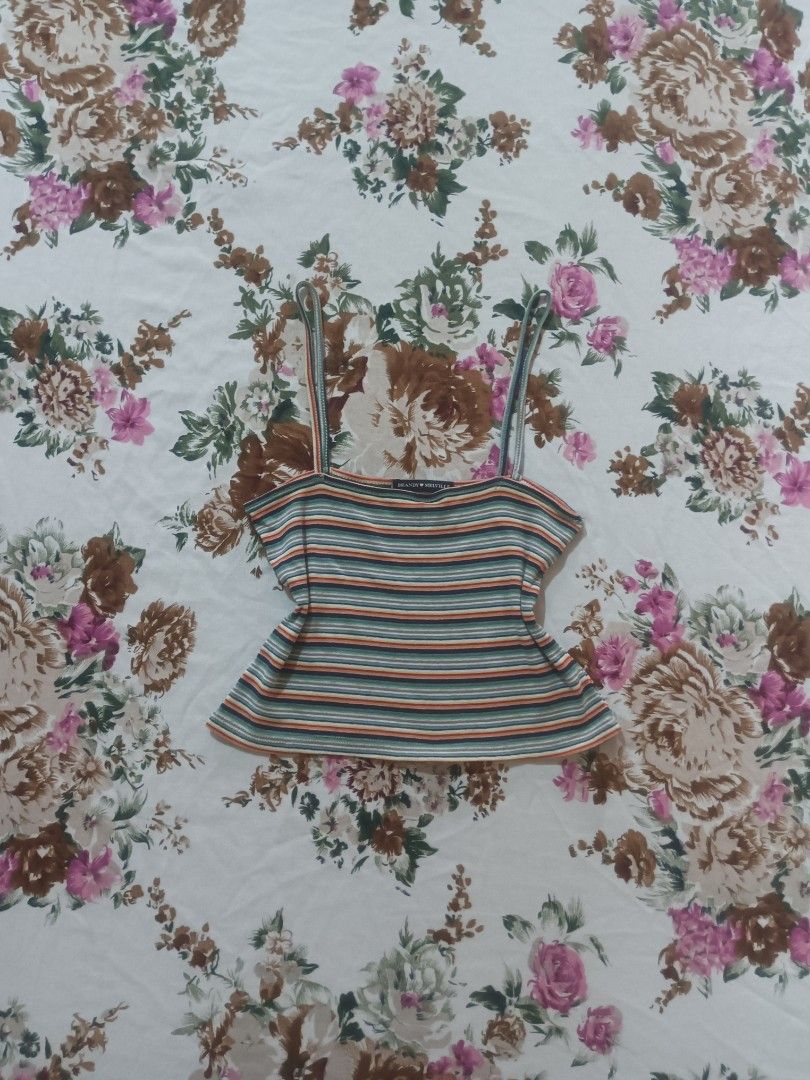 Brandy Melville Striped Top (Category: Sleeveless) located in San Pablo. Submitted by halloweenxx (Listing ID 1459668243, Image 1). Description: - Cute Brandy Melville cropped tank top - Features a colorful stripe pattern - Thin spaghetti straps - Best fits size small or one size - Perfect for casual wear or layering.