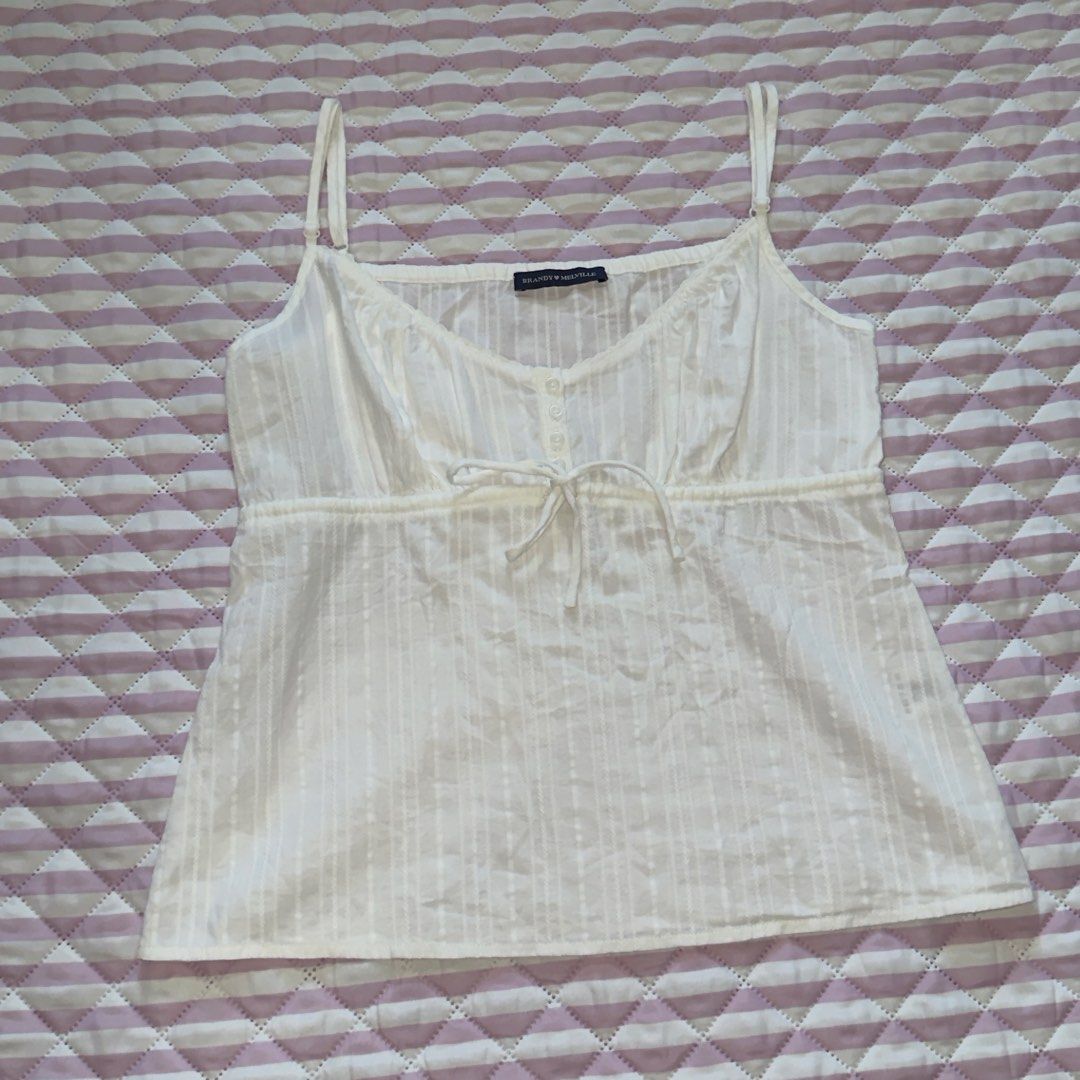 brandy melville tiffany top (Category: Others Tops) located in Bauang. Submitted by meow.dcltr (Listing ID 1459530125, Image 1). Description: brandy melville tiffany top - white one size length: 16.5 inches *excluding strap width: 15.5 inches • adjustable straps & 1 extra button no issues/flaws. 100% authentic. from hk pasabuy. no ww photo.
