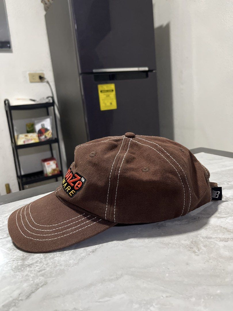 Bronze56k Hardware Cap (Category: Caps & Hats) located in Manila. Submitted by dumsurfer (Listing ID 1459612975, Image 3). Description: - Classic brown heavy duty cap - Features embroidered 'Bronze56k Hardware' logo - White stitching on brim and crown - Adjustable strap for a comfortable fit Can do shipping & Meet up Biñan Laguna.
