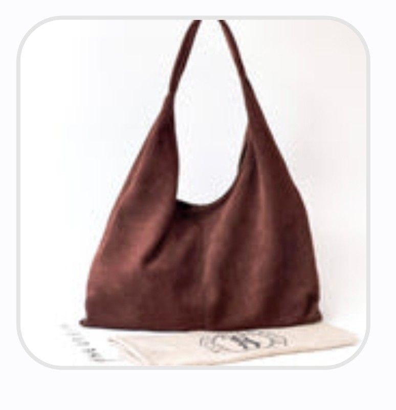 Brown Suede Hobo Shoulder Bag (Category: Shoulder Bags) located in Manila. Submitted by unknowncloset (Listing ID 1459578318, Image 1). Description: - Soft brown suede hobo bag - Single shoulder strap - Spacious interior, ideal for daily essentials - Comes with original dust bag - Minimal signs of wear, excellent pre-loved condition.