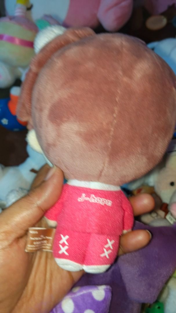 BTS J-Hope Plush Toy (Category: Plushies & Soft Toys) located in Caloocan City. Submitted by silverfalcon.097106 (Listing ID 1459684201, Image 2). Description: - Adorable J-Hope plush toy - Features a cute pink outfit with wing details - 'J-hope' text on the back of the shirt - Made of soft, huggable material - Ideal for BTS fans and collectors - Makes a great gift for friends.