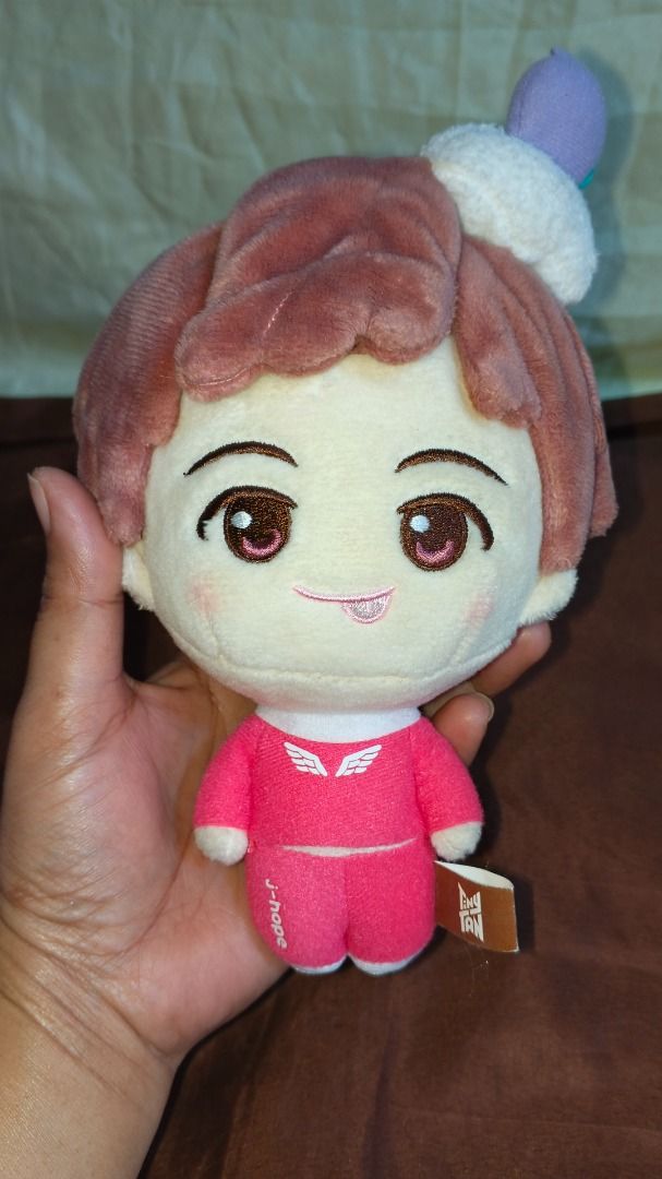 BTS J-Hope Plush Toy (Category: Plushies & Soft Toys) located in Caloocan City. Submitted by silverfalcon.097106 (Listing ID 1459684201, Image 1). Description: - Adorable J-Hope plush toy - Features a cute pink outfit with wing details - 'J-hope' text on the back of the shirt - Made of soft, huggable material - Ideal for BTS fans and collectors - Makes a great gift for friends.