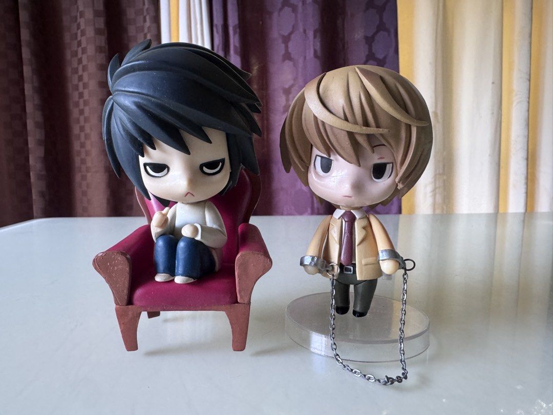 (Bundle) Death Note L and Light Yagami Nendoroid Figures (Category: Figurines & Statues) located in Caloocan City. Submitted by ciel31 (Listing ID 1459534636, Image 2). Description: - Nendoroid figures of L and Light Yagami from Death Note - L includes his iconic chair accessory - Light comes with handcuffs and chain accessory - Ideal for any Death Note fan's collection Bundle. Can’t confirm if these are authentic, unlike my other stuff. The qual