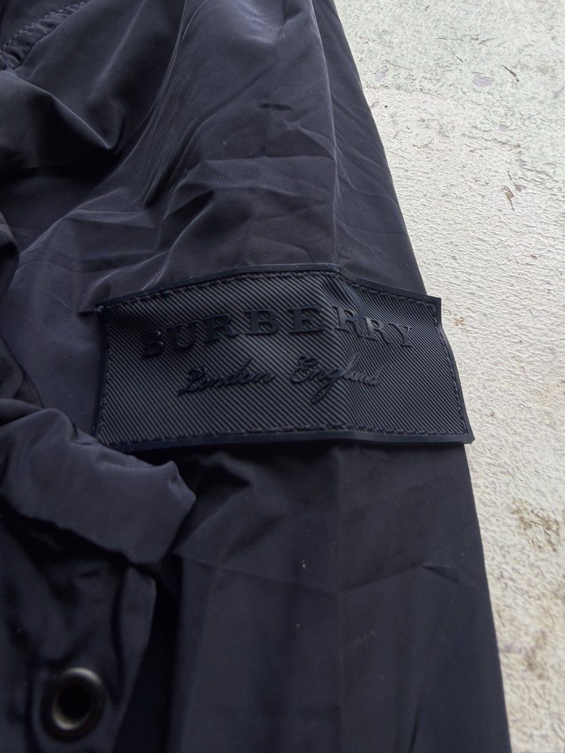 Burberry (Category: Coats, Jackets and Outerwear) located in Quezon City. Submitted by macleen17 (Listing ID 1459618866, Image 3). Description: Burberry Size 50 XL Excllent Condition Packable hood Navy blue Color Burbery rubber patch design Burberry puller E/P underzip.