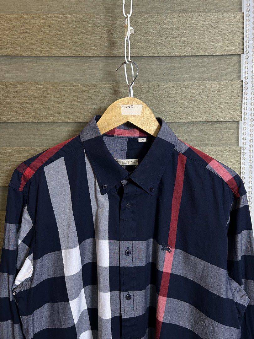 Burberry Nova Check Button-Up Shirt XXL (Category: Tshirts & Polo Shirts ) located in Santa Ana. Submitted by thrift.sanctuary (Listing ID 1459646327, Image 2). Description: 26,22 - Classic Burberry shirt - Iconic Nova Check pattern (navy, red, white) - Button-down collar - Made in England - Size xl - Ideal for smart casual outfits.