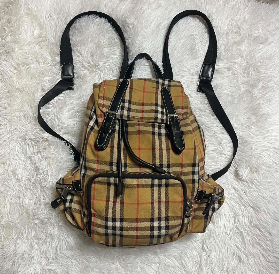 Burberry Vintage Check Nylon Rucksack (Backpack) (Category: Backpacks) located in Manila. Submitted by senggggg. (Listing ID 1459663666, Image 1). Description: good condition working zip sign of use need wash minimal dirt check details and size.