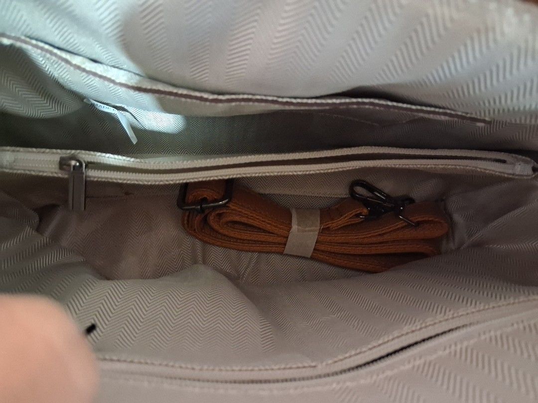 Burberry-style Plaid Handbag with Shoulder Strap (Category: Luxury Bags & Wallets) located in Bulacan. Submitted by lexxx2 (Listing ID 1459540373, Image 3). Description: - Classic plaid design - Tan leather trim and handles - Secure zipper closure - Multiple interior compartments - Interior zippered pocket - Detachable shoulder strap included - Ideal for everyday use - Made in China.