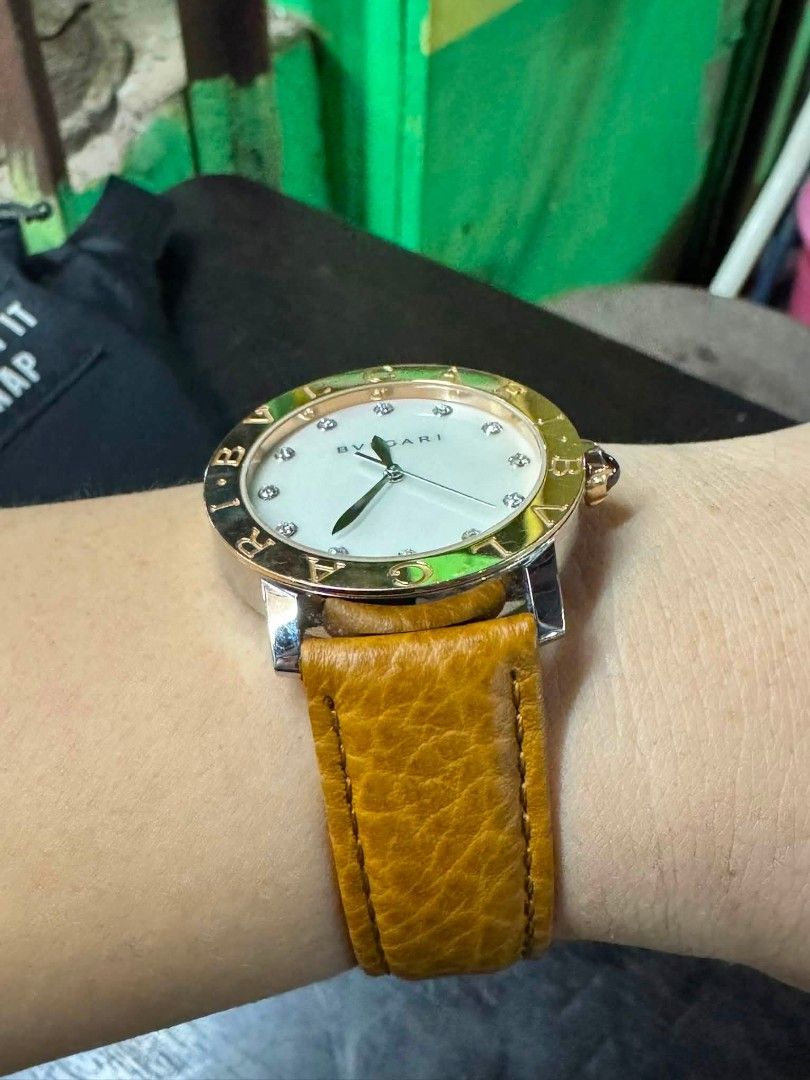 BVLGARI 18K Gold Bezel Diamond Watch (Category: Luxury Watches) located in Daet. Submitted by jemotovlog28 (Listing ID 1459622735, Image 3). Description: - Authentic Bvlgari Watch - Model: BBL P 37 SG - Dial: Mother-of-pearl with diamond hour markers - Bezel: Rose gold - Case: Stainless steel - Strap: Tan leather - Movement: Swiss-made - Versatile for any occasion.