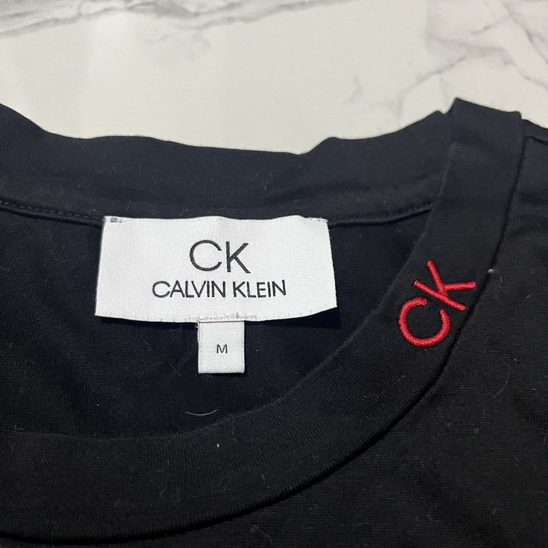 Calvin Klein (Category: Tshirts & Polo Shirts ) located in Bacoor. Submitted by manonghits_2000 (Listing ID 1459648743, Image 2). Description: Calvin Klein Measurement: 19x27 Color: Black Color Rate: 9.7/10 Condition: Good as New Issue: None Claim 350.