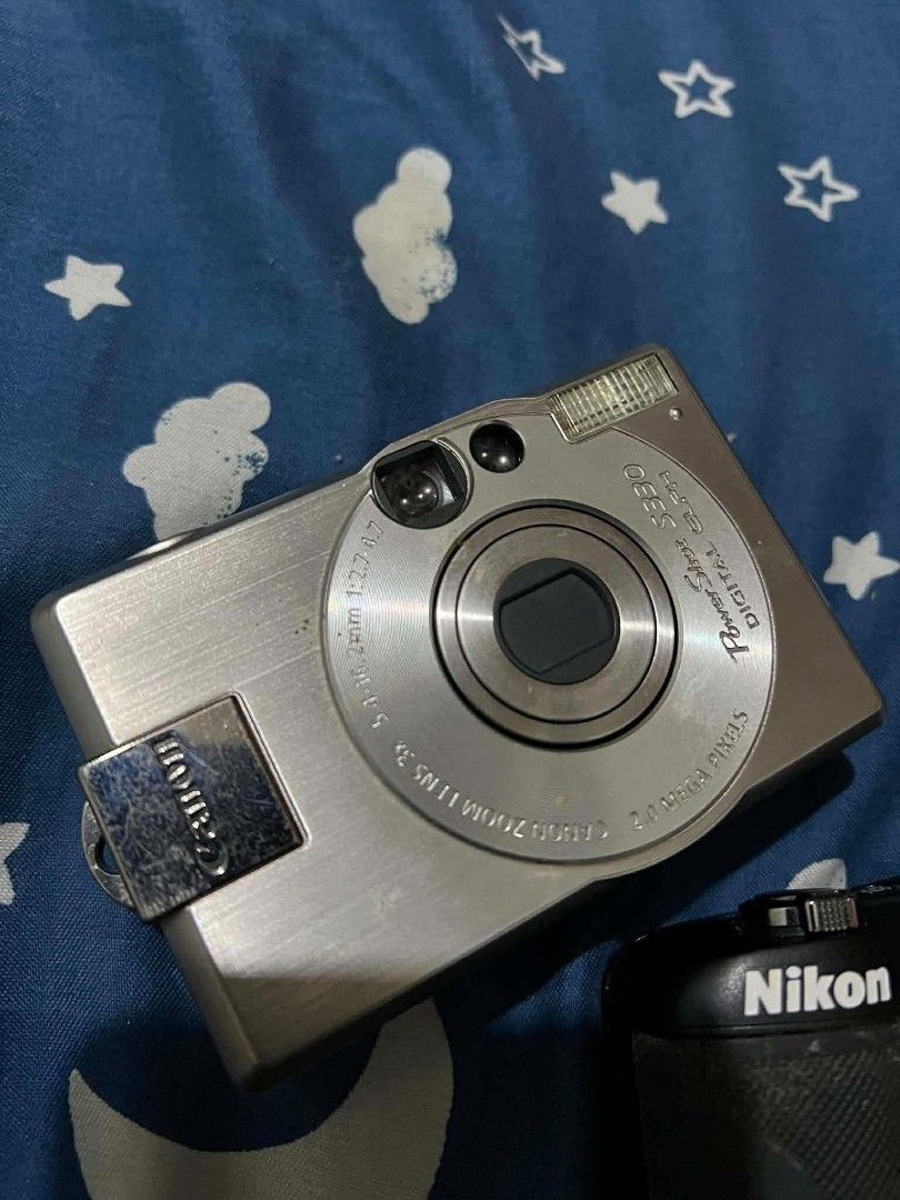 Canon Powershot S330 (Category: Cameras) located in Manila. Submitted by teo.curated (Listing ID 1459621528, Image 2). Description: - Brand: Canon - Model: Powershot S330 - Type: Digital Point-and-Shoot Camera - Color: Silver - Material: Durable metal body - Condition: Good, as shown in images - Features: Compact and easy to use.