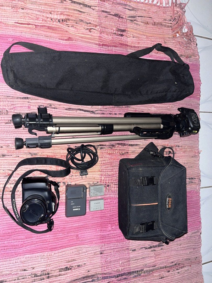 Canon PowerShot SX30 IS Digital Camera with Accessories (Category: Cameras) located in Manila. Submitted by valerianok00376 (Listing ID 1459683877, Image 1). Description: - Canon PowerShot SX30 IS camera - Canon camera bag included - Tripod with bag - Two (2) batteries - Battery charger - Neck strap - Ideal for travel and everyday photography - Ready for your next adventure! HONEST ISSUE -- DOT ON DISPLAY SCREEN (DOES NOT AFFECT OUTPUT QUALITY) R