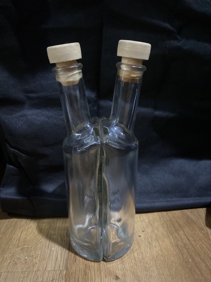 Capri Prima Limoncello Double Bottle with Corks (Category: Water Bottles & Tumblers) located in Taguig. Submitted by cosmickindle (Listing ID 1459581214, Image 2). Description: - Unique double bottle design - Marked 'Capri Prima Limoncello' - Made of clear glass - Comes with two cork stoppers - Ideal for serving or display - Features an interesting and eye-catching design - No box - RFS: Not in use - Slightly negotiable **First to pay gets it** *