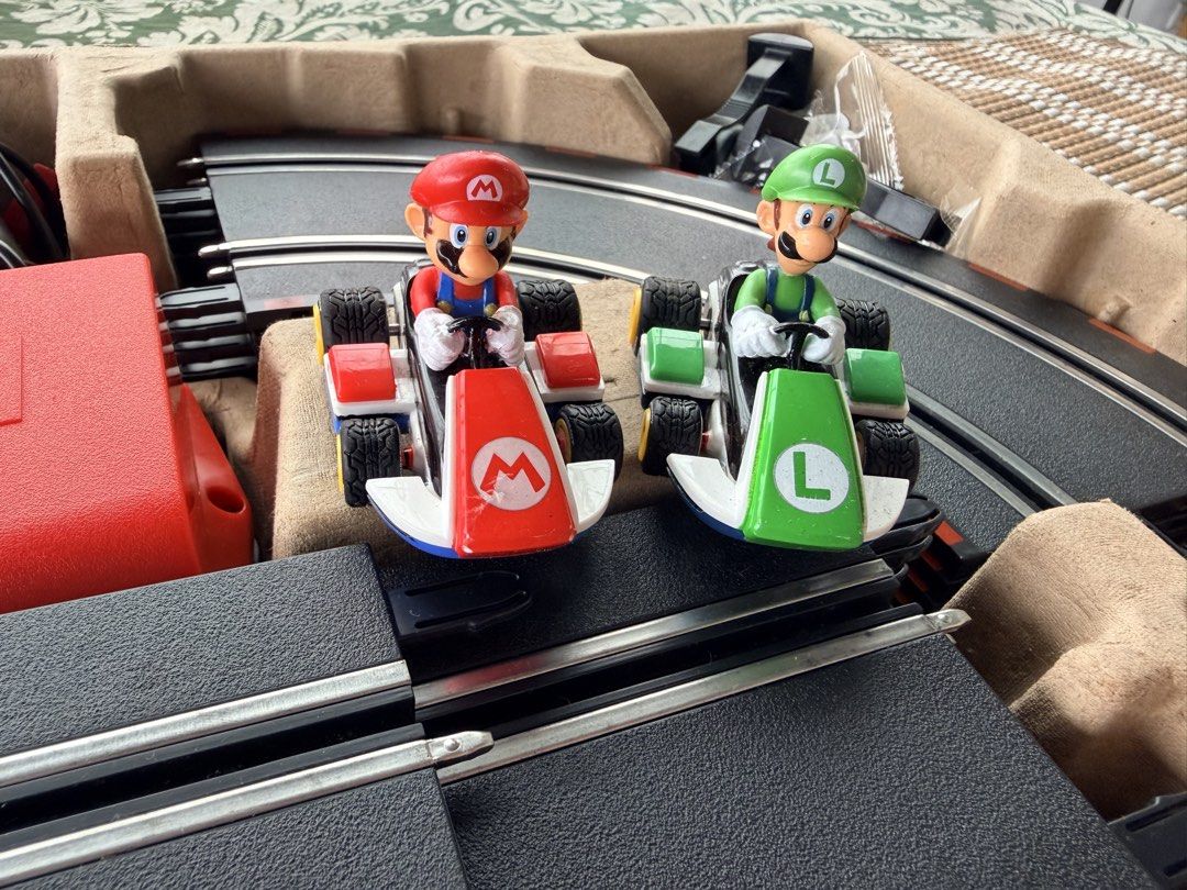 Mario Toy (Category: Vehicle & Diecast Models) located in Quezon City. Submitted by trishanelle (Listing ID 1459510957, Image 3). Description: - Carrera GO!!! Mario Kart slot car racing set - Includes Mario and Luigi cars - Track length: 4.3m (14.1 ft) - Battery operated cars and controllers - Expandable with electric sets and accessories - Transformer sold separately.