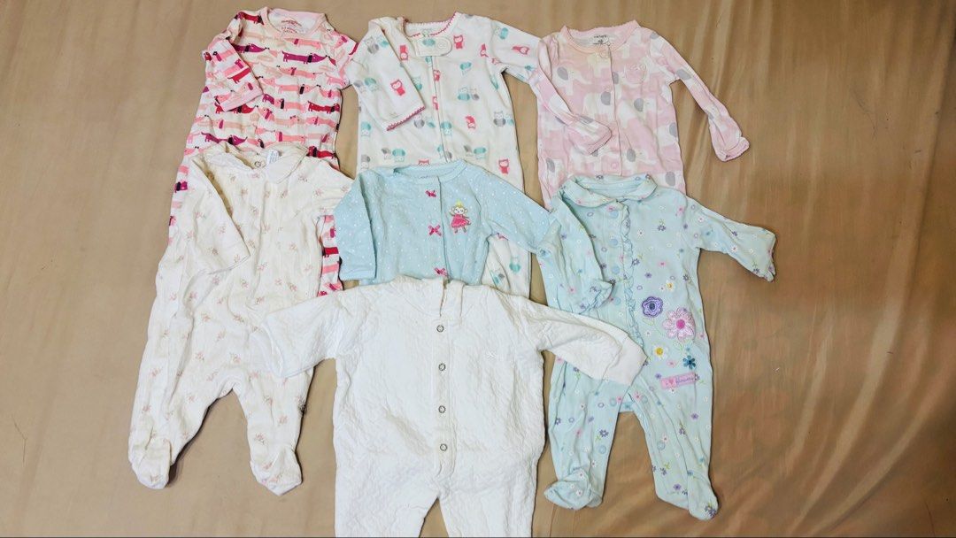 Carters Baby Sleepers Bundle (7 pcs) (Category: Babies & Kids Fashion) located in Quezon City. Submitted by mommyclutter (Listing ID 1459546207, Image 1). Description: - Bundle of 11 baby sleepers - Assorted prints and colors (pink, white, light blue) - All sleepers have footies - Mix of long and short sleeves - Features both snaps and zippers for easy dressing - Perfect for keeping your baby warm and comfortable Selling my baby's preloved frogsu