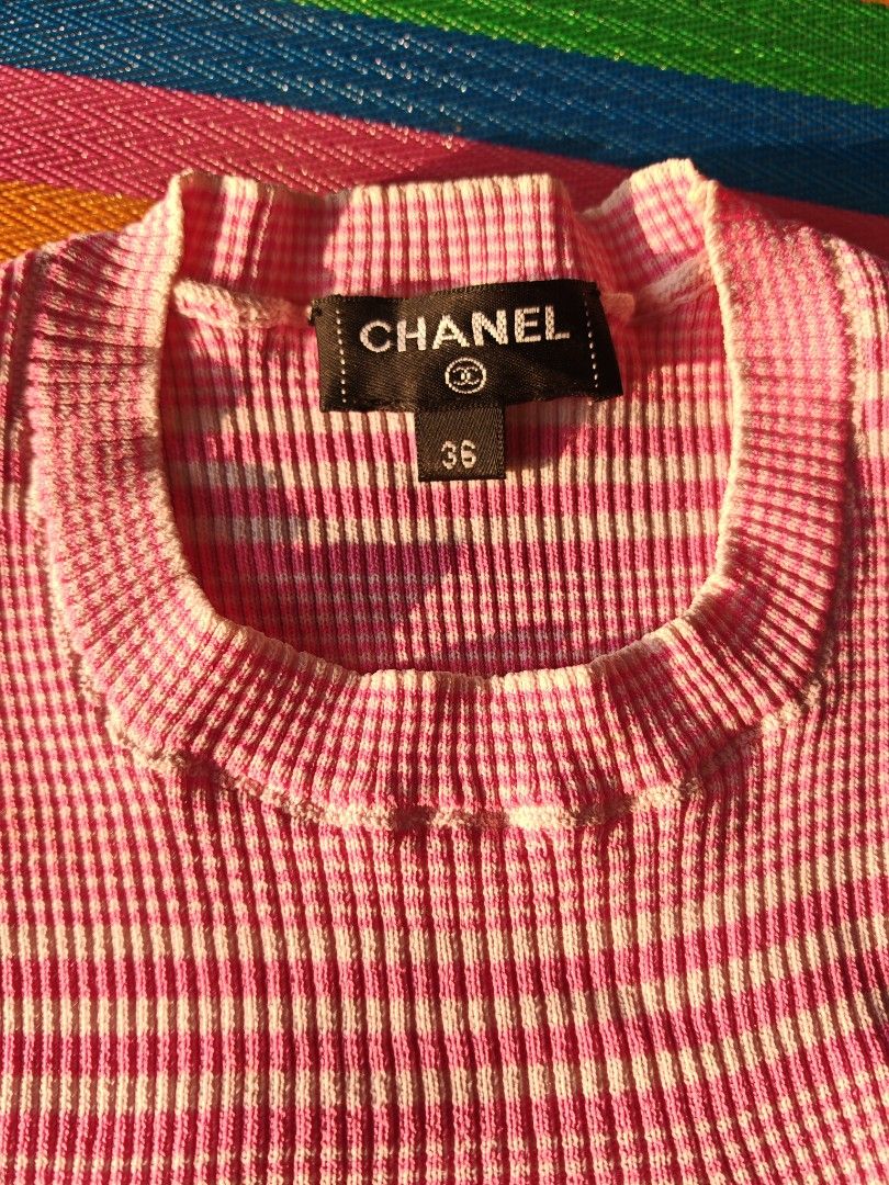 Chanel Pink White Gingham Knit top CC Logo (Category: Luxury Apparel) located in Manila. Submitted by ukayhuntworldwide (Listing ID 1459687873, Image 2). Description: - Authentic Chanel Knit Dress - Size: 36 - Color: Pink and White Gingham Pattern - Iconic CC Logo on Chest - Short Sleeves - Crew Neck - Material: Cotton Blend - Made in Italy.