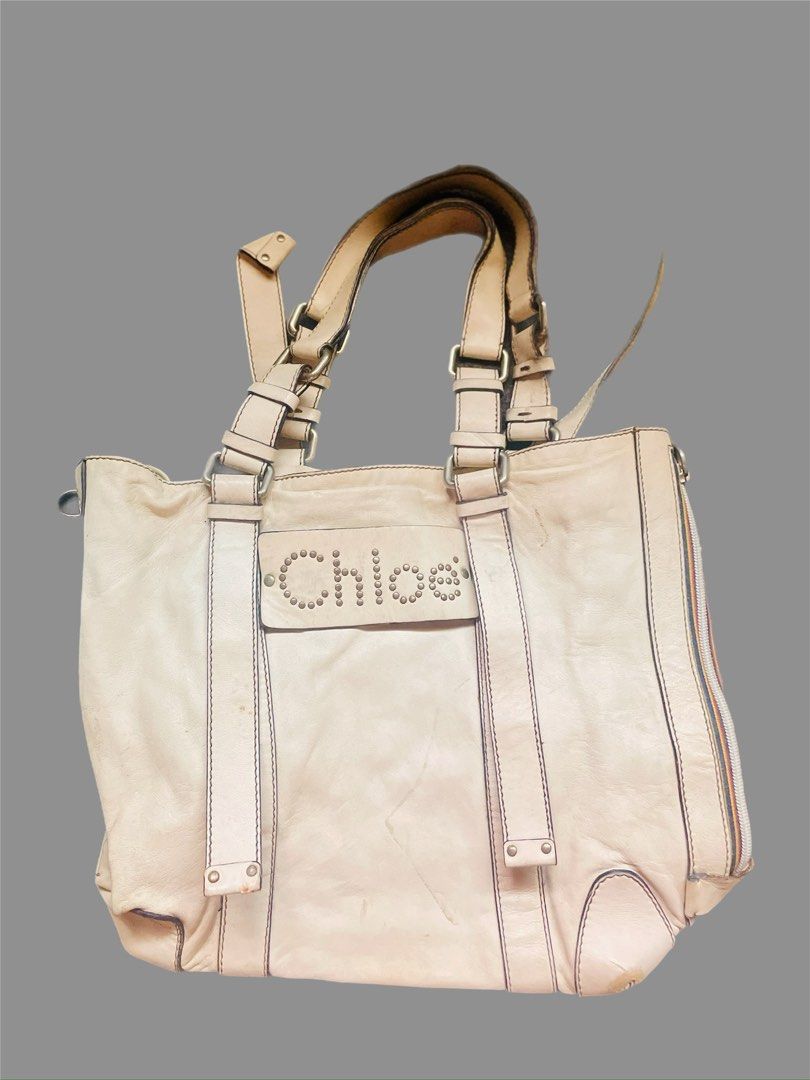 Chloe Leather Tote Bag (Category: Luxury Bags & Wallets) located in Caloocan City. Submitted by hardestea2026 (Listing ID 1459672256, Image 1). Description: - Light beige Chloe leather tote bag - Features Chloe logo with stud detailing on the front - Double top handles for comfortable carrying - Secure side zip closure - Ample interior space for all your essentials - Ideal for everyday use.