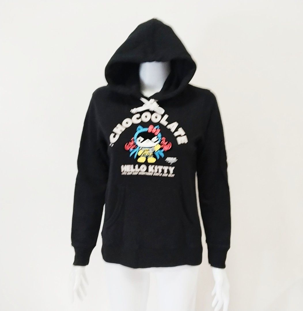 CHOCOOLATE x Hello Kitty Hoodie Black XS (Category: Coats, Jackets and Outerwear) located in Pateros City. Submitted by blashjunks.y2k (Listing ID 1459553824, Image 1). Description: - Brand: Chocoolate x Kitty collaboration - Item: Black Hoodie - Size: XS - Design: "Cool" graphic print of Kitty dressed as Batman - Features: Front pocket, drawstring hood - Perfect for: Kitty and Chocoolate fans.