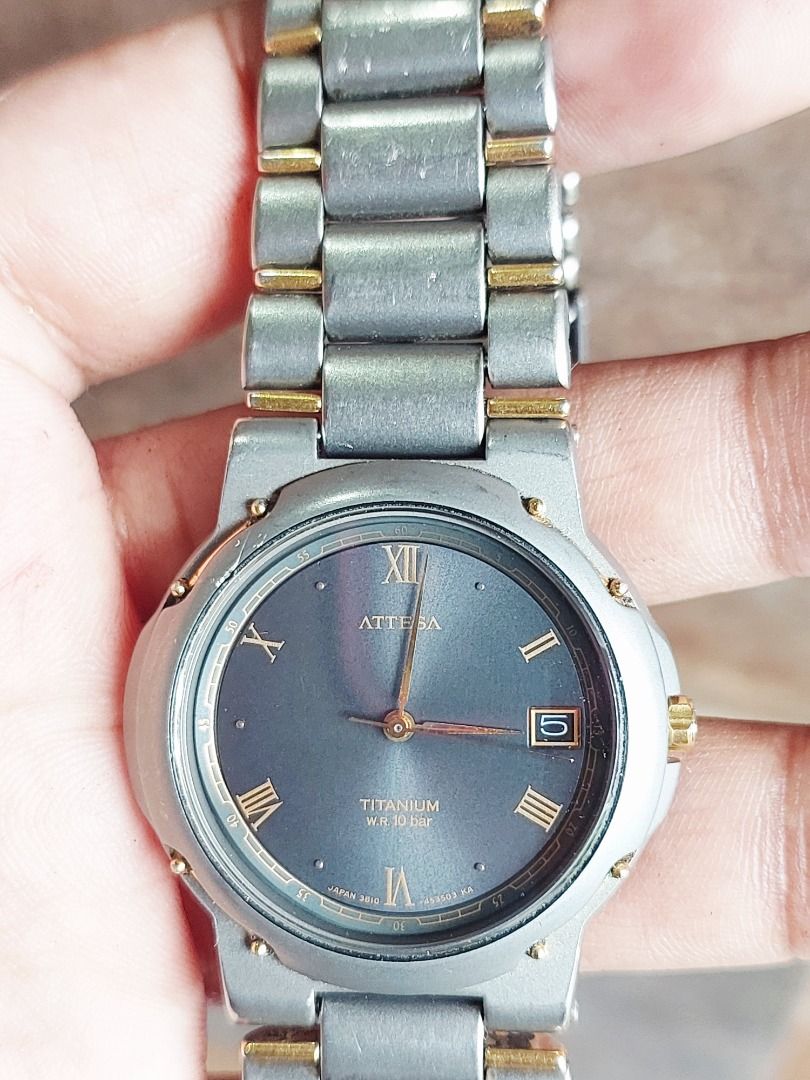 Citizen Attesa Titanium Watch (Category: Men's Watches) located in Batangas. Submitted by vintageanddainty (Listing ID 1459557927, Image 3). Description: - Citizen Attesa watch - Made of durable titanium - Water resistant up to 10 bar - Features a sophisticated dark dial with Roman numerals - Includes a convenient date window - Stylish two-tone metal bracelet with elegant gold accents - Shows some signs of wear consistent with age, adding to its 