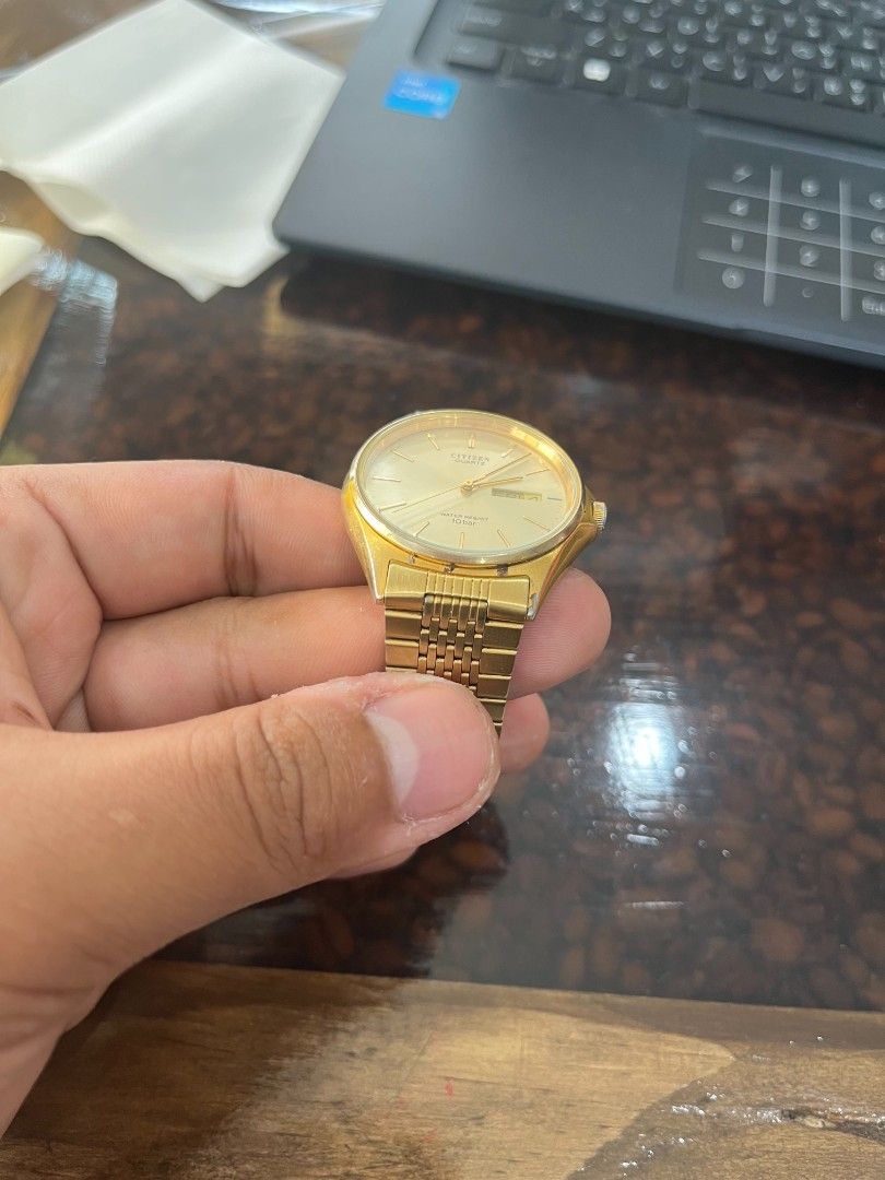 Citizen Gold Tone Watch Day Date (Category: Luxury Watches) located in Cebu City. Submitted by jbok_watches. (Listing ID 1459630163, Image 2). Description: - Gold tone Citizen watch - Features day and date display - Water resistant up to 30 meters - Classic link bracelet design - Secure fold-over clasp - Versatile for everyday wear or dressing up.