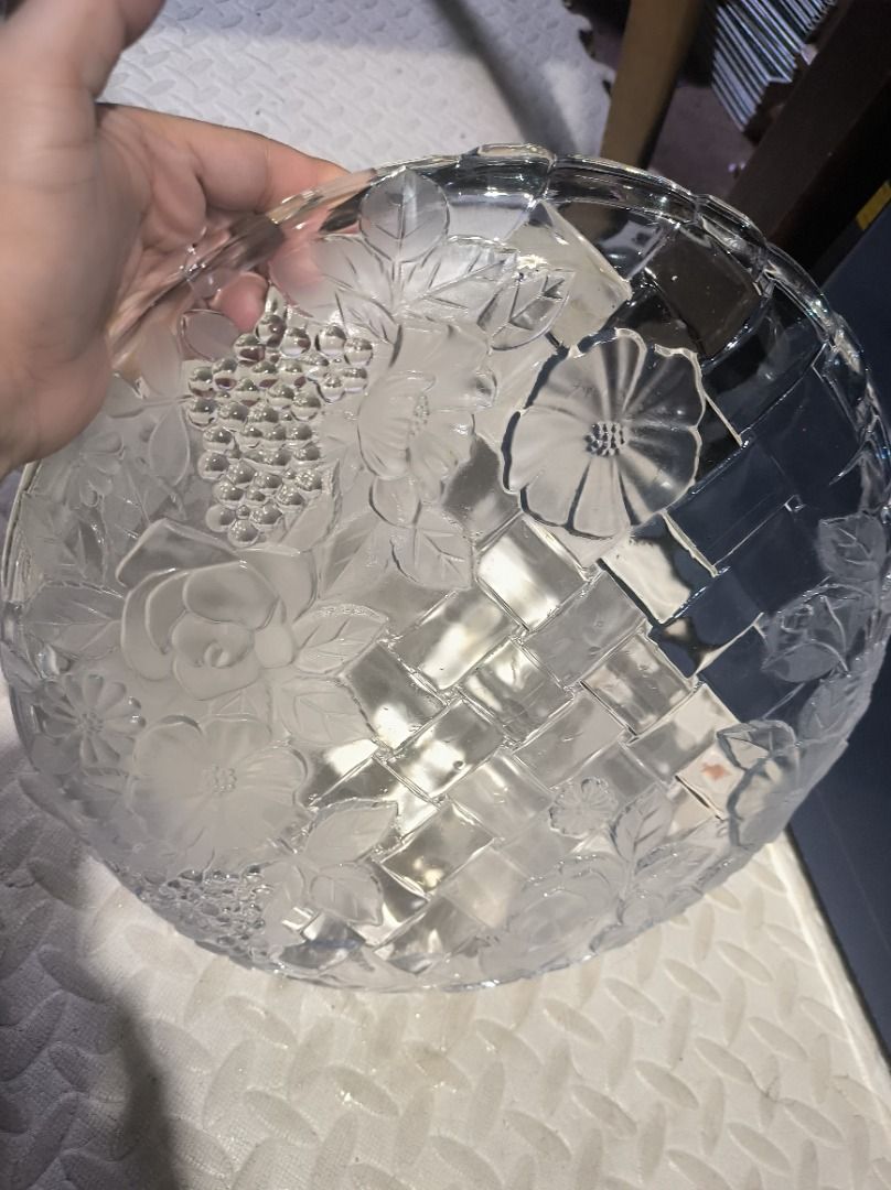 Clear Glass Serving Tray with Floral Embossing (Category: Other Kitchenware & Tableware) located in Manila. Submitted by silent_vonachiles (Listing ID 1459553679, Image 2). Description: - Elegant round glass serving tray, approximately 12 inches in diameter. - Features a unique woven basket pattern. - Adorned with embossed flowers and leaves for a decorative touch. - Scalloped edges add a charming, sophisticated detail. - Ideal for serving snacks