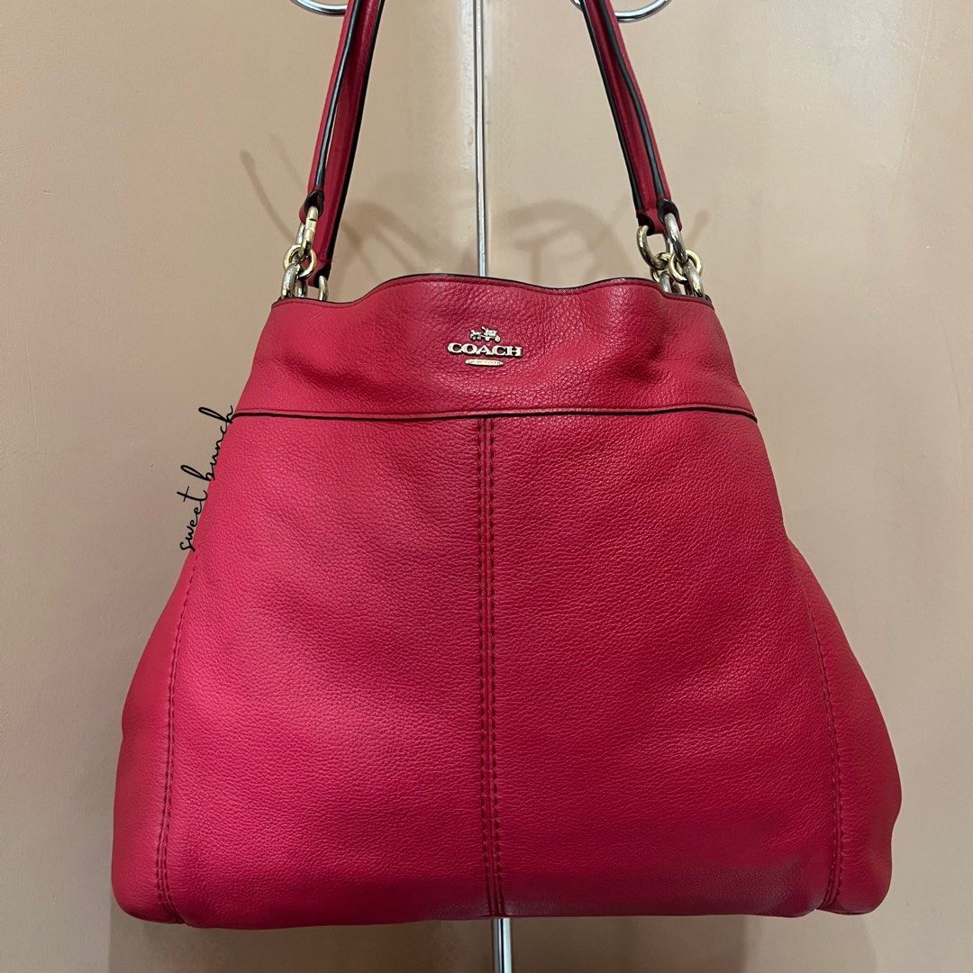 Coach Cherry Pink Lexy Shoulder Bag (Category: Luxury Bags & Wallets) located in Taytay. Submitted by sweet_bunch (Listing ID 1459650254, Image 3). Description: Details: - Model Number is N° J1757-F57545. - Bag comes with an ordinary dustbag. Condition: - May sign of use sa leather and hardware (need polish). - Creed peel-off. - Selling for reasonable price, so manage your expectation. Reminders: - If marked available, still available! - No to lo