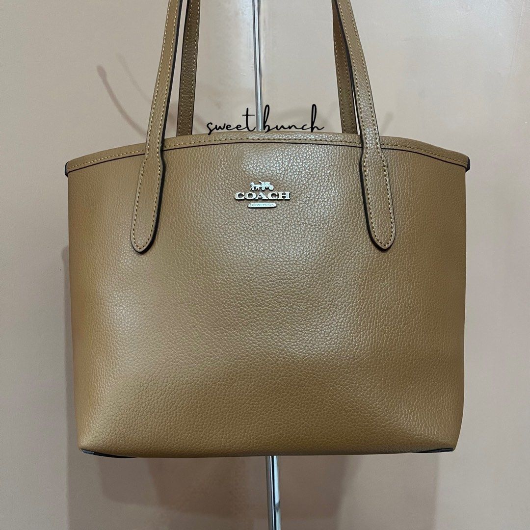 Coach British Tan Mini City Tote Bag (Category: Luxury Bags & Wallets) located in Taytay. Submitted by sweet_bunch (Listing ID 1459655111, Image 3). Description: Details: - Model Number is N° C2492-CT859. - Bag comes with an ordinary dustbag. Condition: - Lightly sign of use sa leather and coach hardware replaced. - Yung brand hardware sa loob mismo ng bag is missing. - Selling for reasonable price, so manage your expectation. Reminders: - If mar