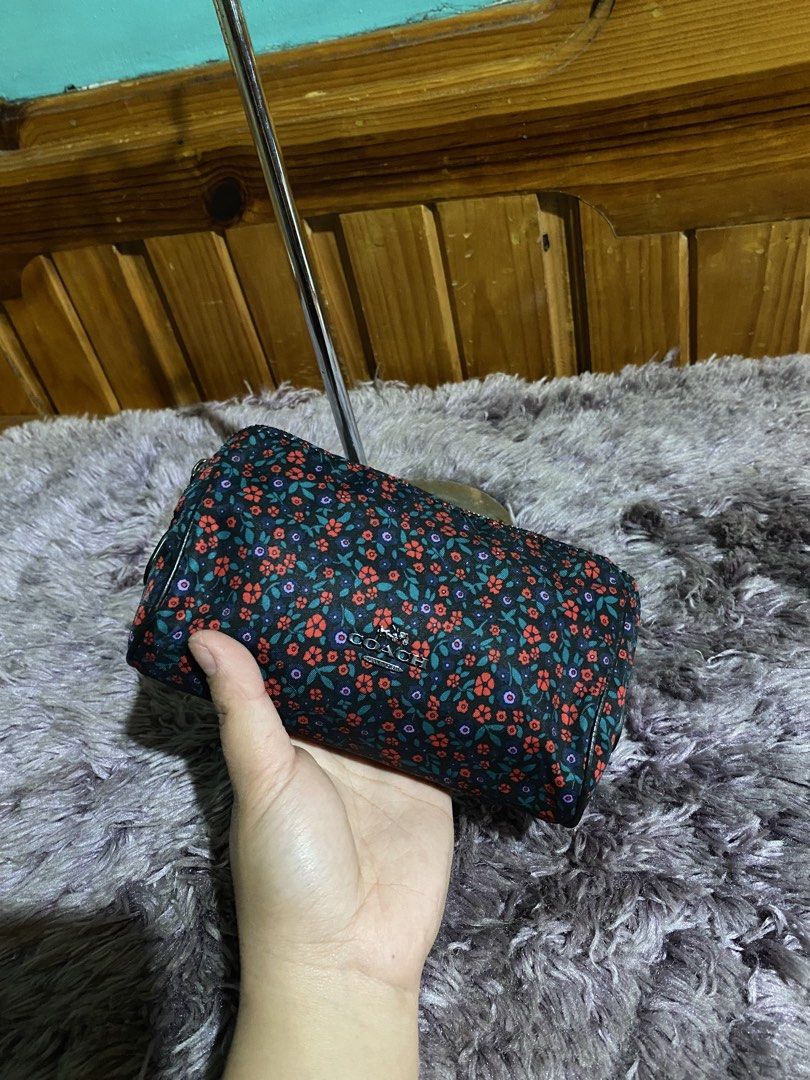 Coach Floral Cosmetic Bag Pouch (Category: Luxury Bags & Wallets) located in La Trinidad. Submitted by kinleyky (Listing ID 1459618046, Image 3). Description: - Cute Coach cosmetic bag - Features a dark floral print with red and purple flowers - Zipper closure - Ideal for makeup or small essentials - Compact and easy to carry.