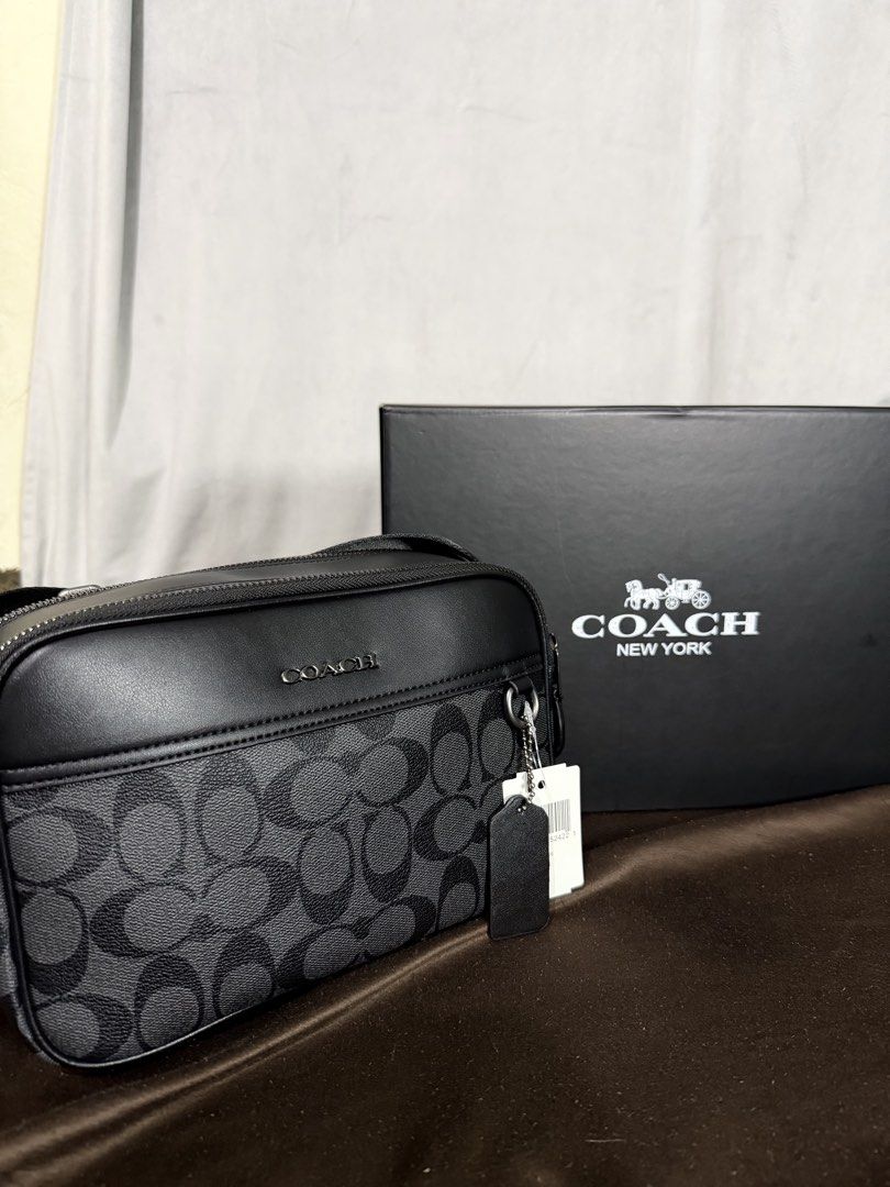 Coach Graham Crossbody (Category: Sling Bags) located in Makati City. Submitted by jamesluxefinds (Listing ID 1459674838, Image 1). Description: Authentic Mall Pull Out Size:26.7 cm (L) × 16.5 cm (H) × 5.7 cm (W) What Fits Inside ✅ iPhone Pro Max or similar large phone ✅ Long wallet or card holder ✅ Keys ✅ AirPods/earbuds ✅ Passport ✅ Small power bank ✅ Sunglasses (soft case) ✅ Charger cable Comes With Dust Bag and Box.