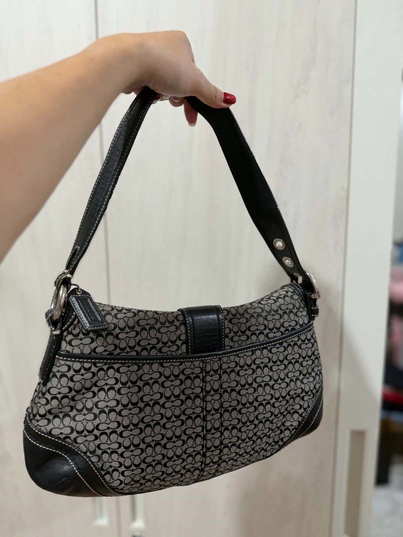 Coach Monogram Shoulder Bag (Category: Luxury Bags & Wallets) located in Antipolo. Submitted by Jhedqt. (Listing ID 1459543020, Image 2). Description: - Classic Coach shoulder bag - Signature monogram canvas with black leather trim - Silver buckle detail on front flap - Interior zippered pocket - Adjustable strap - Great for everyday use Soho Rank SA-A.