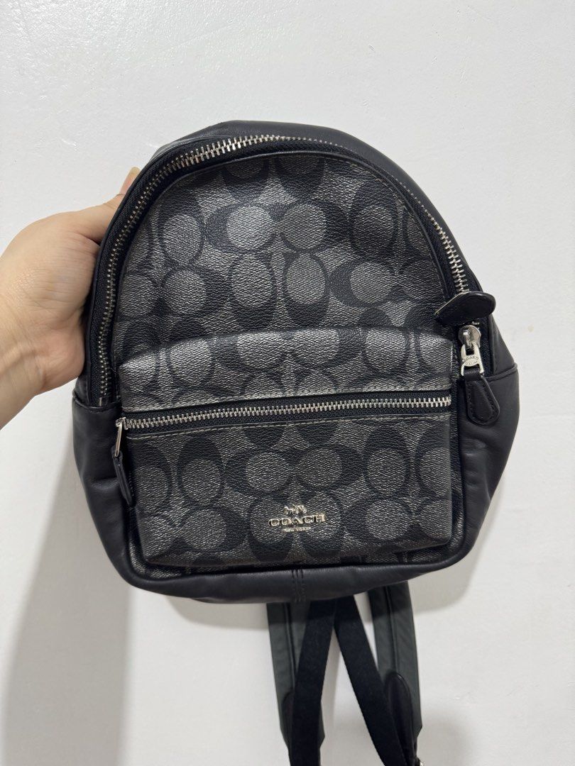 Coach Signature Monogram Backpack Black Leather (Category: Luxury Bags & Wallets) located in Marikina City. Submitted by bangsfrancisco (Listing ID 1459521052, Image 1). Description: May scratches siya pero di naman halata See 3rd picture - Authentic Coach backpack in signature monogram print - Stylish black leather trim and straps - Secure main compartment with zip closure - Convenient front zip pocket - Interior Coach leather tag for authentici