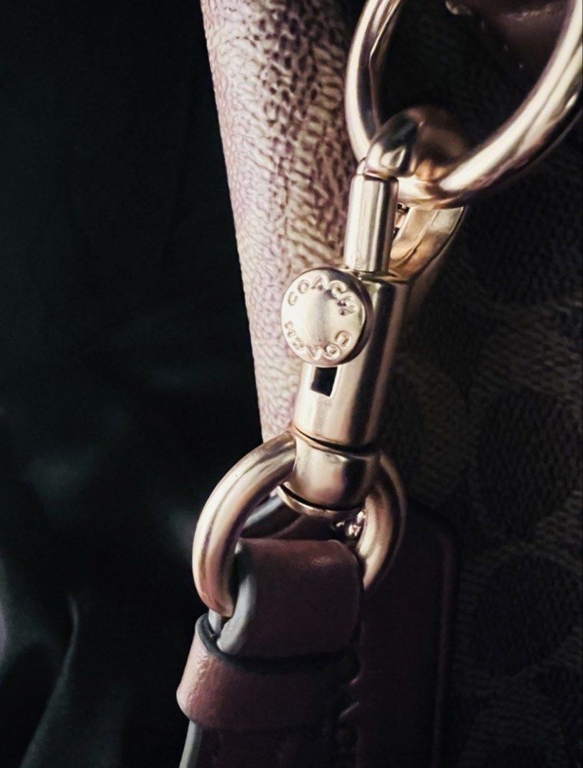 Coach Signature Monogram Bucket Bag with Strap (Category: Luxury Bags & Wallets) located in Las Pinas. Submitted by lyrehs1981 (Listing ID 1459601885, Image 3). Description: - Coach bucket bag - Signature monogram print in brown and tan - Detachable crossbody strap included - Elegant gold hardware details - Interior slip pocket for essentials - Ideal for everyday wear.