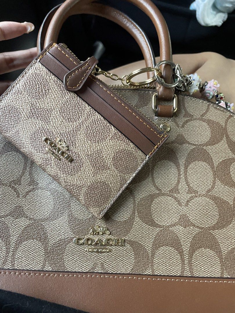 Coach Sierra bag only (Category: Luxury Bags & Wallets) located in Makati City. Submitted by sayonaracuratedcollections (Listing ID 1459531985, Image 2). Description: - Small Coach dome Sierra in signature monogram print - Brown leather trim and handles - Comes with a matching cardholder attached - Gold hardware - Great everyday bag with plenty of space inside.
