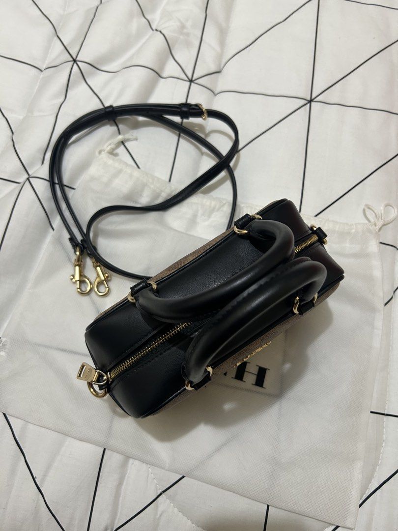 Coach Signature Monogram Mini Barrel Bag (Category: Luxury Bags & Wallets) located in Manila. Submitted by donnadumaguin (Listing ID 1459626330, Image 2). Description: Coach mini barrel bag in signature monogram print. Black leather trim and handles. Comes with a detachable crossbody strap. Gold hardware details. Includes the original dust bag. Great for carrying essentials..