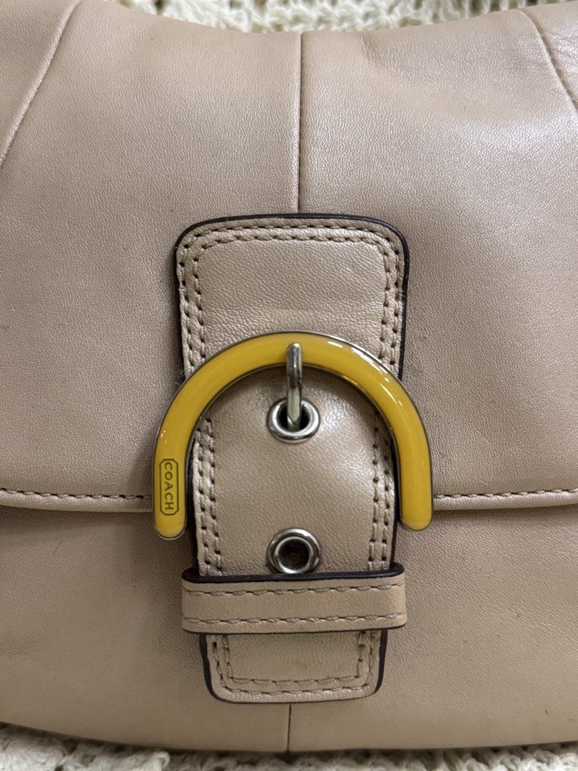 Coach Soho Shell (Category: Luxury Bags & Wallets) located in Bacolod City. Submitted by vintage_vogue6100 (Listing ID 1459668459, Image 3). Description: Coach Soho Shell Pearlescent Leather Flap Small Crossbody Purse Yellow Buckle Can ship via JNT.
