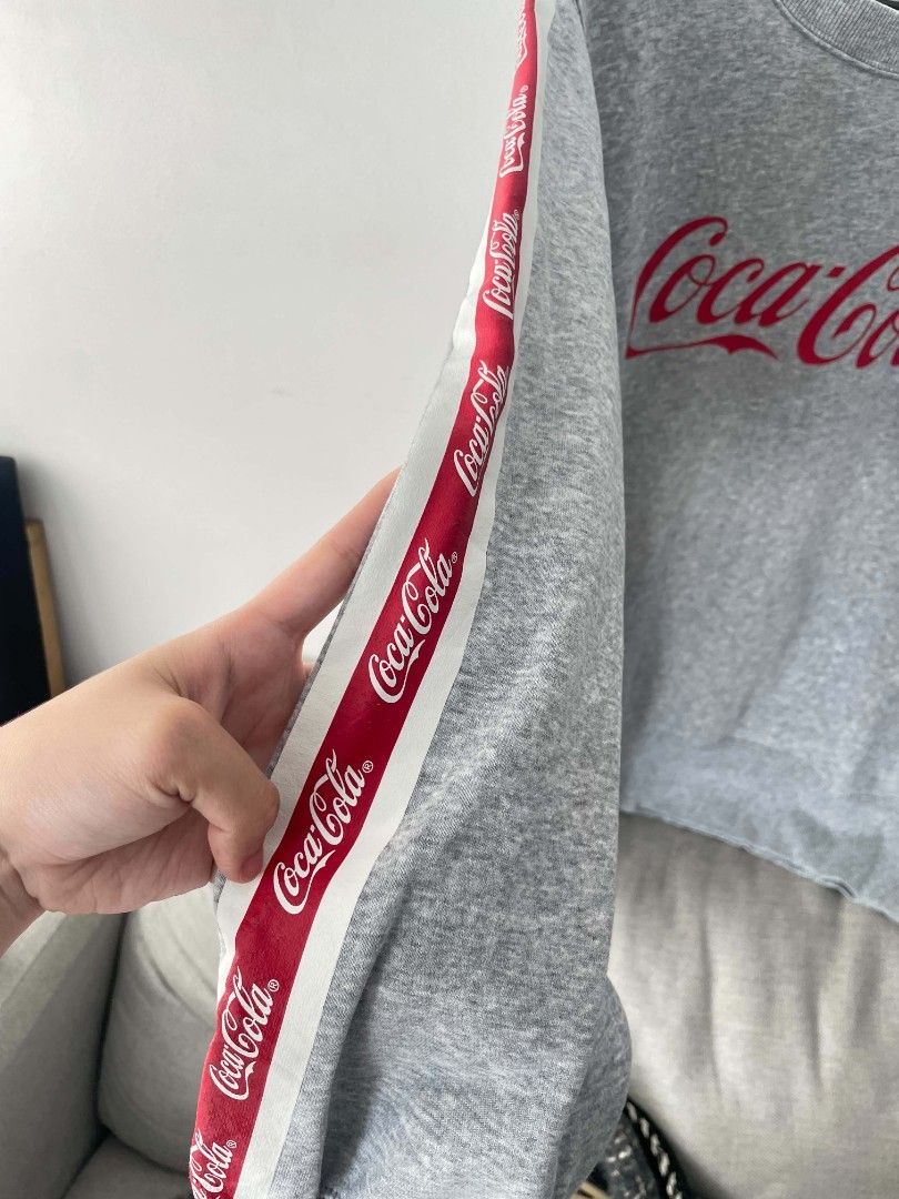 Coca Cola Gray Sweater (Category: Coats, Jackets and Outerwear) located in Quezon City. Submitted by mariaplusmoshi (Listing ID 1459583503, Image 2). Description: Coca-Cola Sweater❤️ SIZE: M-L Color rate: 10/10 Minimal Issue: slightly stretched neckline Lalamove/J&T MOP: Gcash 📍Ever, Commonwealth, Q.C.