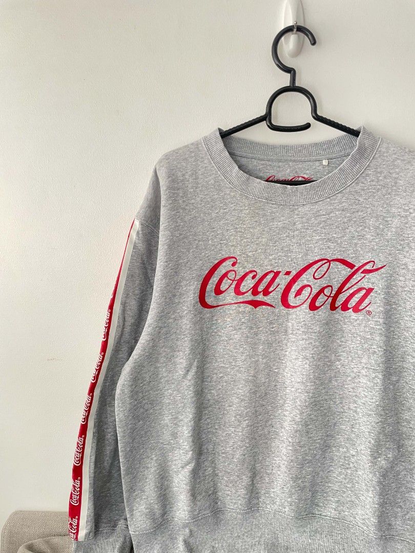 Coca Cola Gray Sweater (Category: Coats, Jackets and Outerwear) located in Quezon City. Submitted by mariaplusmoshi (Listing ID 1459583503, Image 3). Description: Coca-Cola Sweater❤️ SIZE: M-L Color rate: 10/10 Minimal Issue: slightly stretched neckline Lalamove/J&T MOP: Gcash 📍Ever, Commonwealth, Q.C.