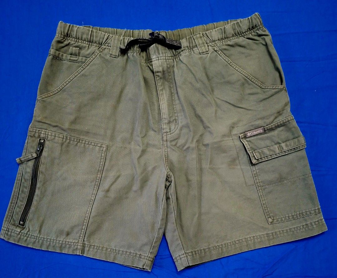 Columbia Cargo Short (Category: Activewear) located in Antipolo. Submitted by d.tuazon (Listing ID 1457863214, Image 1). Description: These olive green Columbia cargo shorts feature an elastic waistband and an integrated buckled web belt.This item shown is a Columbia Sportswear men's outdoor utility cargo bottoms (such as the Silver Ridge or GRT line), characterized by an integrated webbed belt with a plastic buckle and a partial elastic waistban