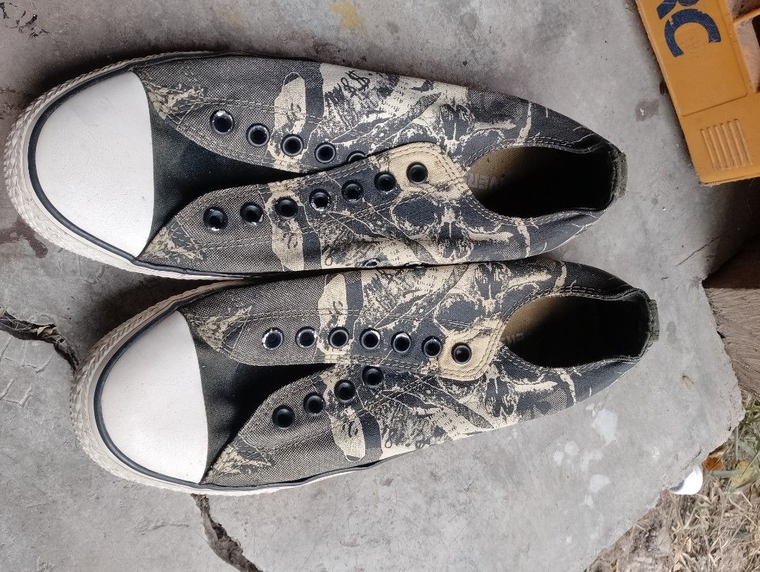 Converse All Star Camo Low Top Sneakers (Category: Sneakers) located in Manila. Submitted by paul281 (Listing ID 1459545656, Image 2). Description: - Classic Converse All Star low tops - Cool camouflage pattern - White rubber toe cap and sole - Laces included - Great for casual wear - Shows some signs of wear on sole and canvas.