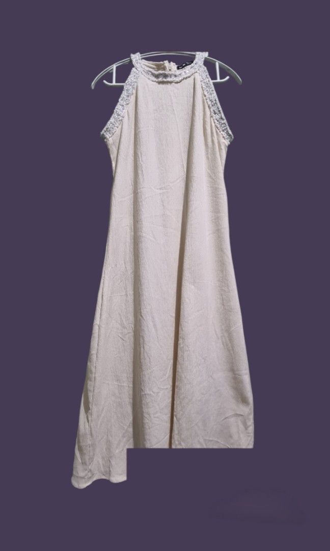 Cream/Off-White Beaded Halter Dress (Category: Dresses) located in Manila. Submitted by jinkaye01164296 (Listing ID 1459547725, Image 1). Description: ​Type: Elegant sleeveless midi dress with a halter neckline accented by silver beading or embellishments around the collar..